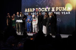 NEW YORK, NEW YORK - DECEMBER 04: Arne Freundt and A$AP Rocky speak onstage at the Footwear News Achievement Awards (FNAAs) 2024 at Cipriani South Street on December 04, 2024 in New York City. (Photo by Craig Barritt/Footwear News via Getty Images)